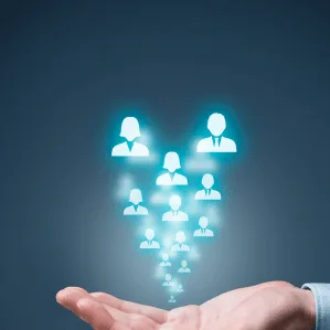 A cupped hand with glowing icons of people rising from it