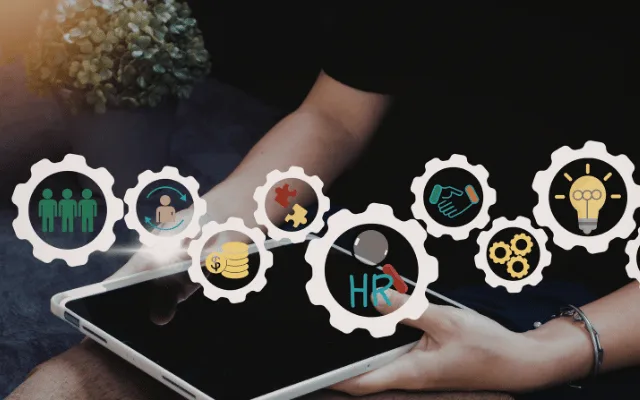 A practitioner working on a tablet, surrounded by icons representing the many moving parts of running a practice