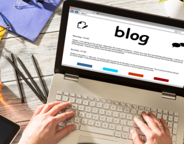 Writing a blog on a laptop