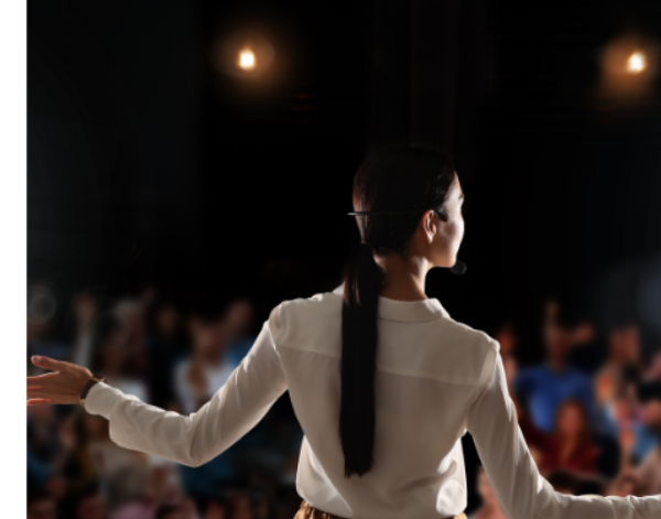 Speaking to an audience from a stage